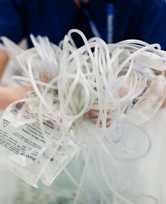 nurse holding PVC products ready for recycling
