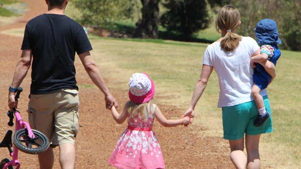 WA Family holding hands
