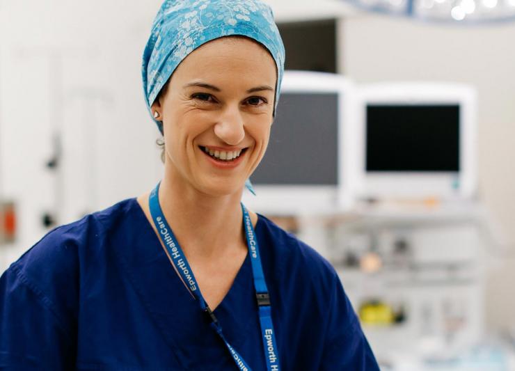 Nurse smiling in hospital setting