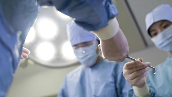 Doctors in surgery room working