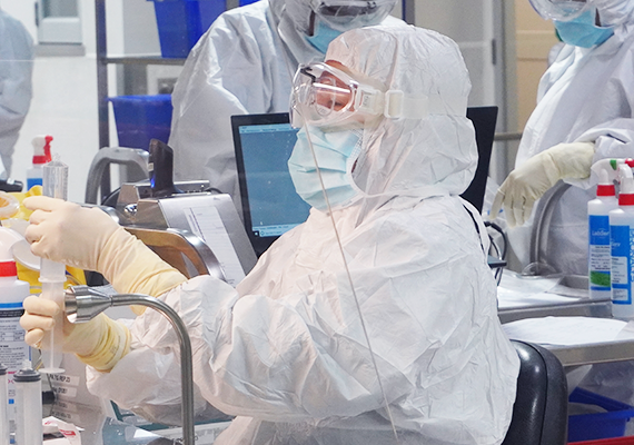 baxter employee compounding medicines in clean room